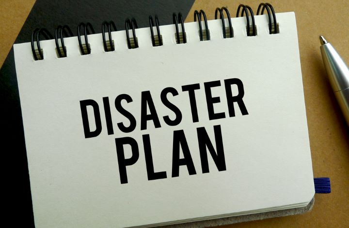 Disaster plan written on a spiral notebook page 